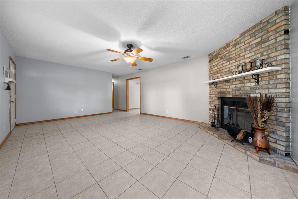 2645 Southeast 162nd Place Road Summerfield, FL 34491 - Photo 7 of 38 a view of an empty room with a fireplace