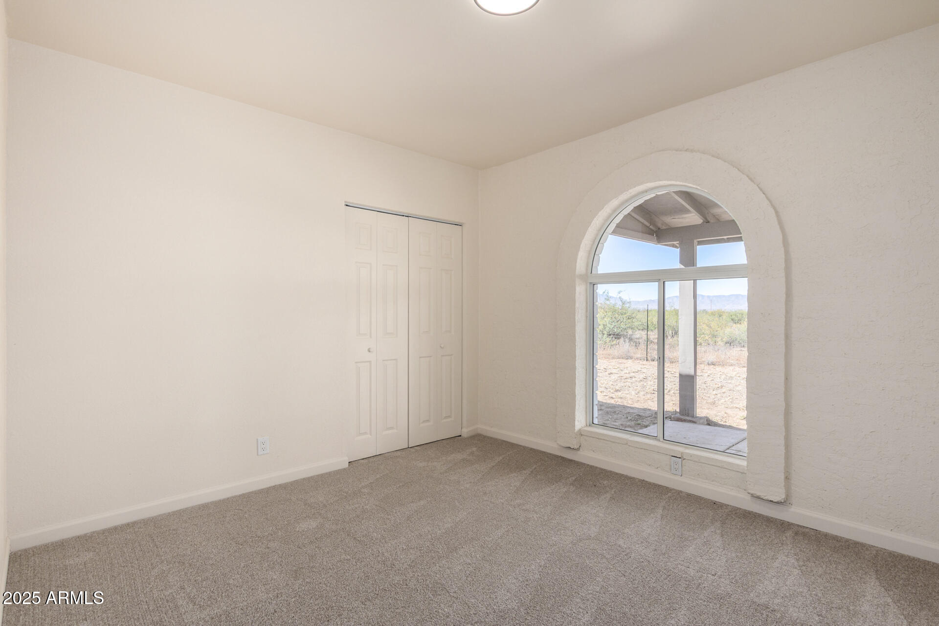 3613 East White Tail Road Pearce, AZ 85625 - Photo 16 of 39 an empty room with windows