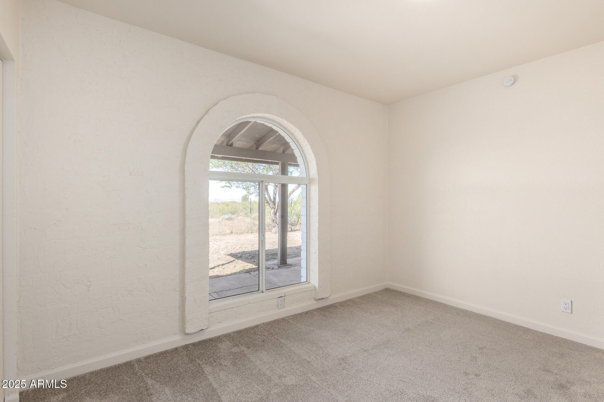 3613 East White Tail Road Pearce, AZ 85625 - Photo 18 of 39 an empty room with windows