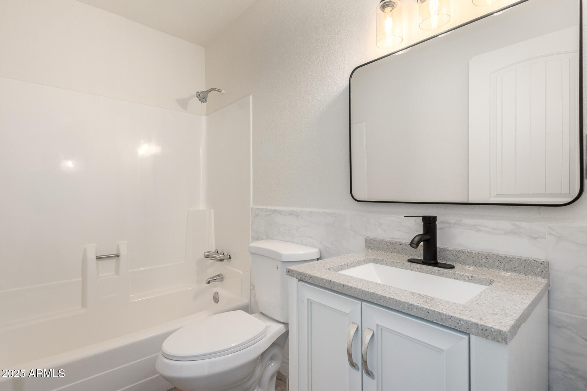 3613 East White Tail Road Pearce, AZ 85625 - Photo 19 of 39 a bathroom with a toilet sink and mirror