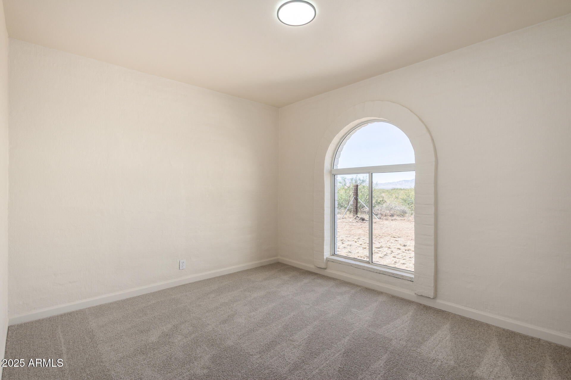 3613 East White Tail Road Pearce, AZ 85625 - Photo 20 of 39 an empty room with windows and closet