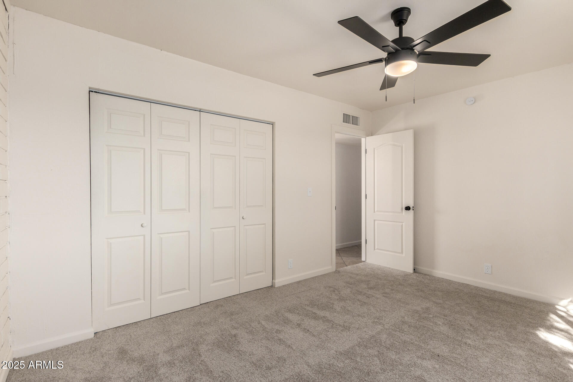 3613 East White Tail Road Pearce, AZ 85625 - Photo 24 of 39 an empty room with a ceiling fan