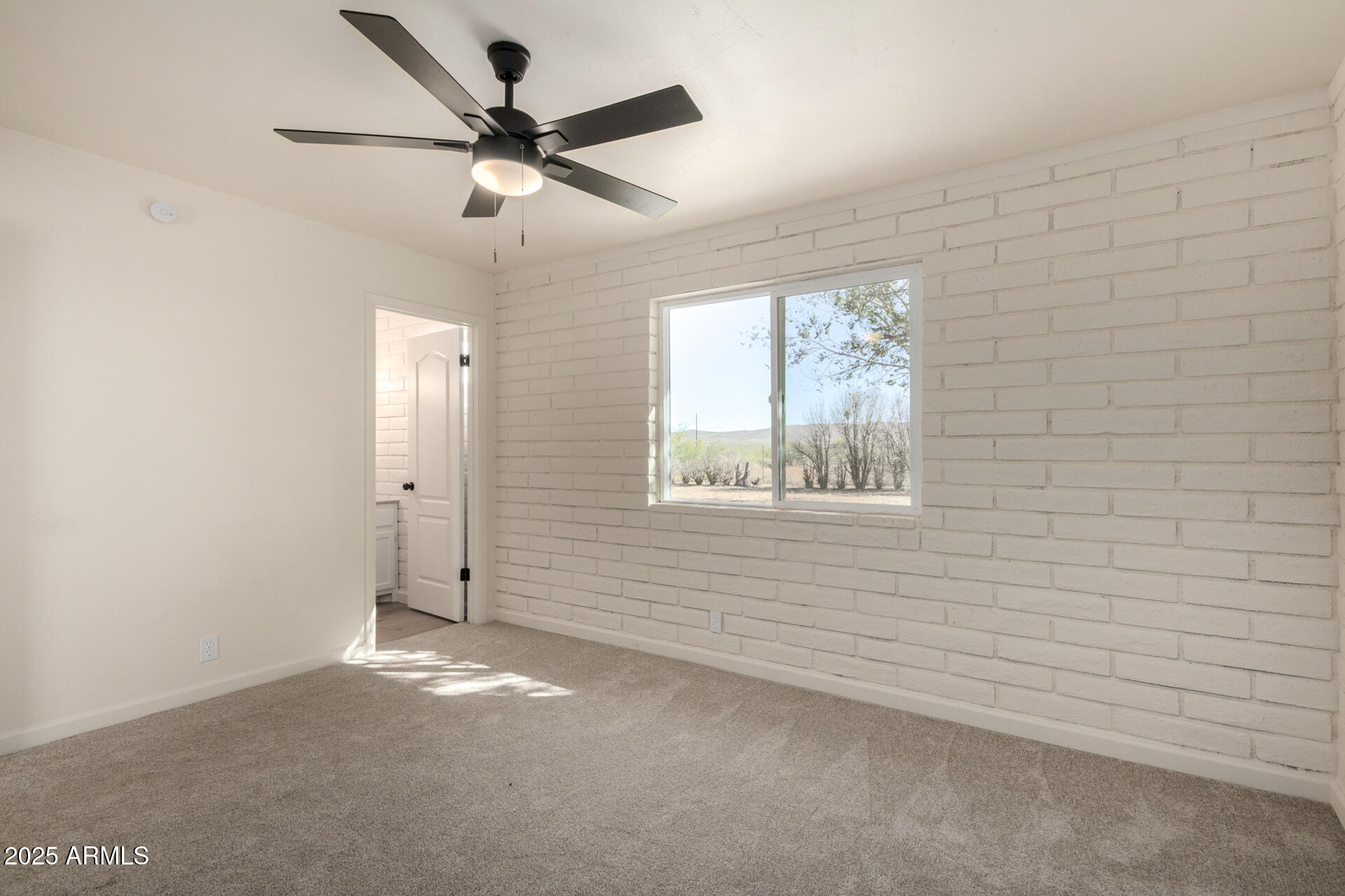 3613 East White Tail Road Pearce, AZ 85625 - Photo 25 of 39 a view of an empty room with a window