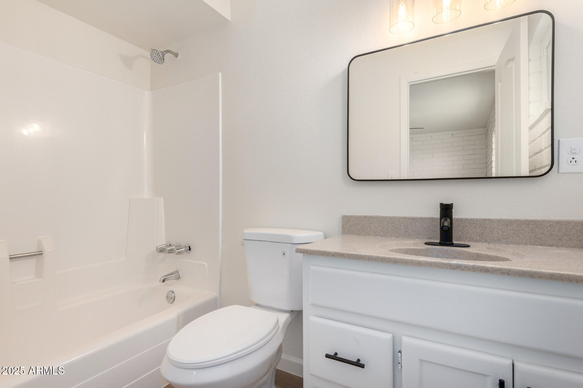 3613 East White Tail Road Pearce, AZ 85625 - Photo 26 of 39 a bathroom with a toilet sink vanity and mirror