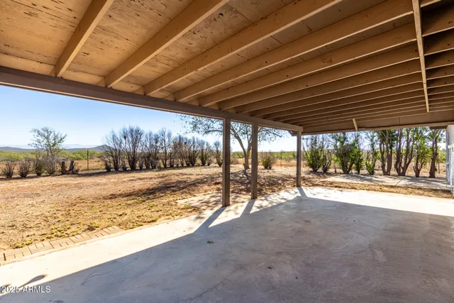 a view of a backyard of the house