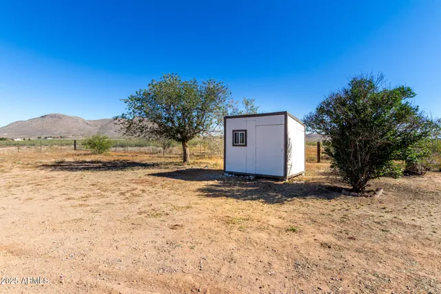 a view of backyard with mountain view