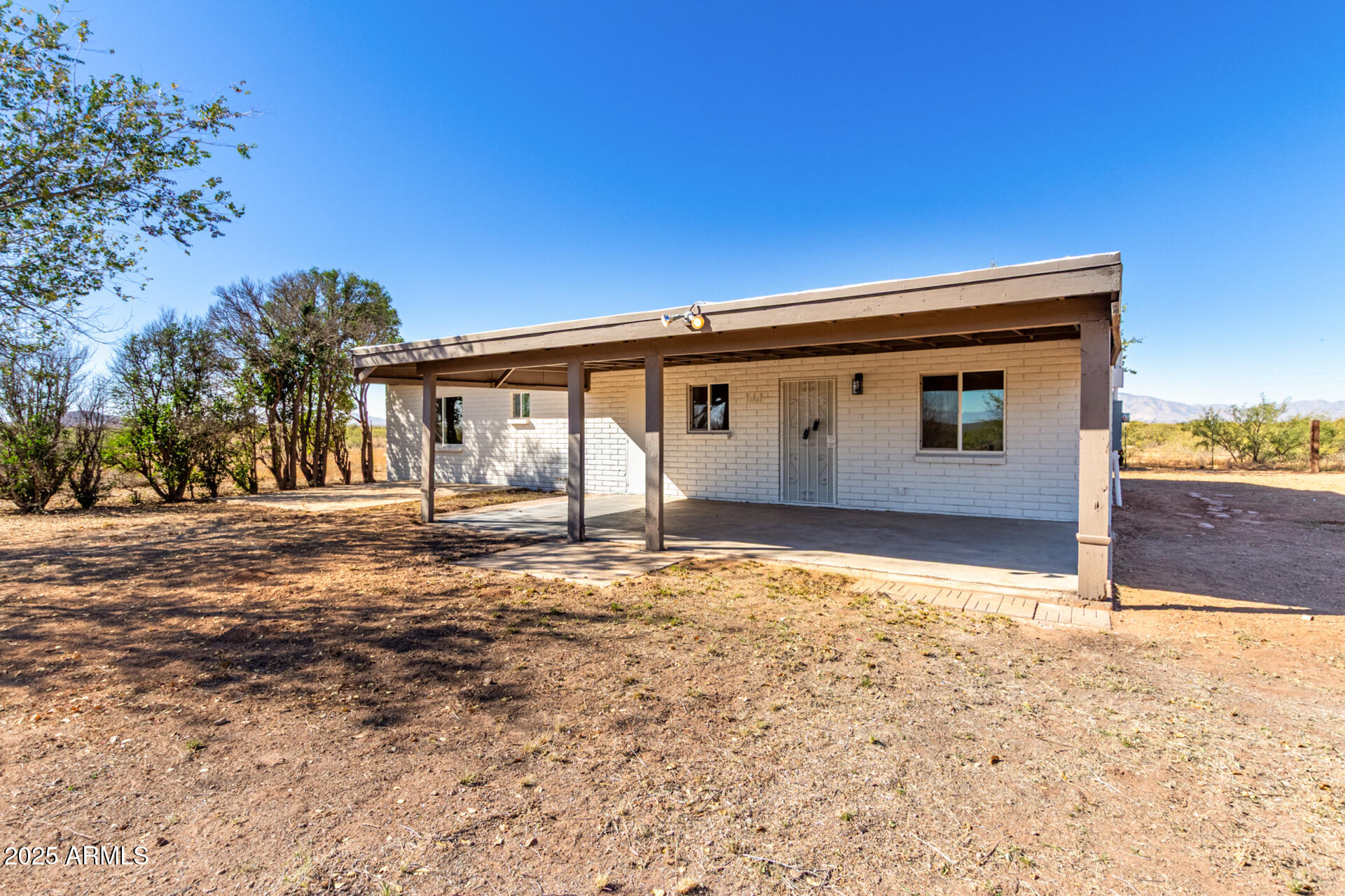 3613 East White Tail Road Pearce, AZ 85625 - Photo 34 of 39 front view of a house with a yard