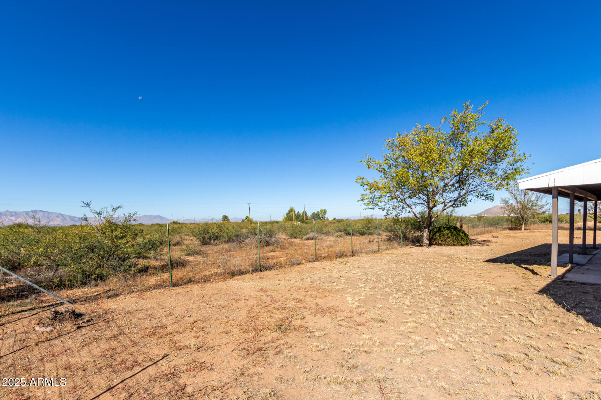 3613 East White Tail Road Pearce, AZ 85625 - Photo 37 of 39 a view of a yard with wooden fence