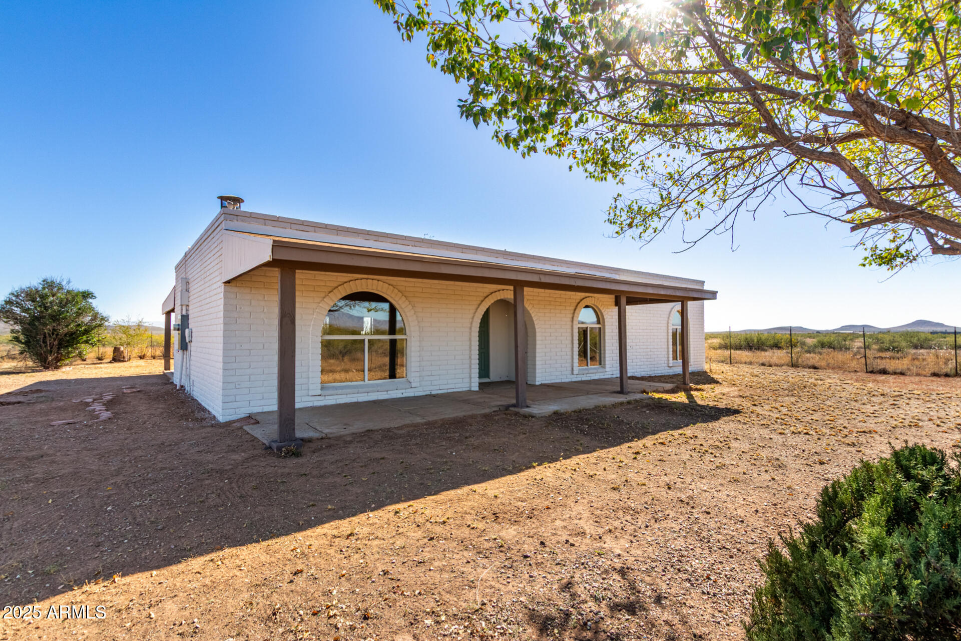 3613 East White Tail Road Pearce, AZ 85625 - Photo 5 of 39 a front view of a house with a yard and lake view