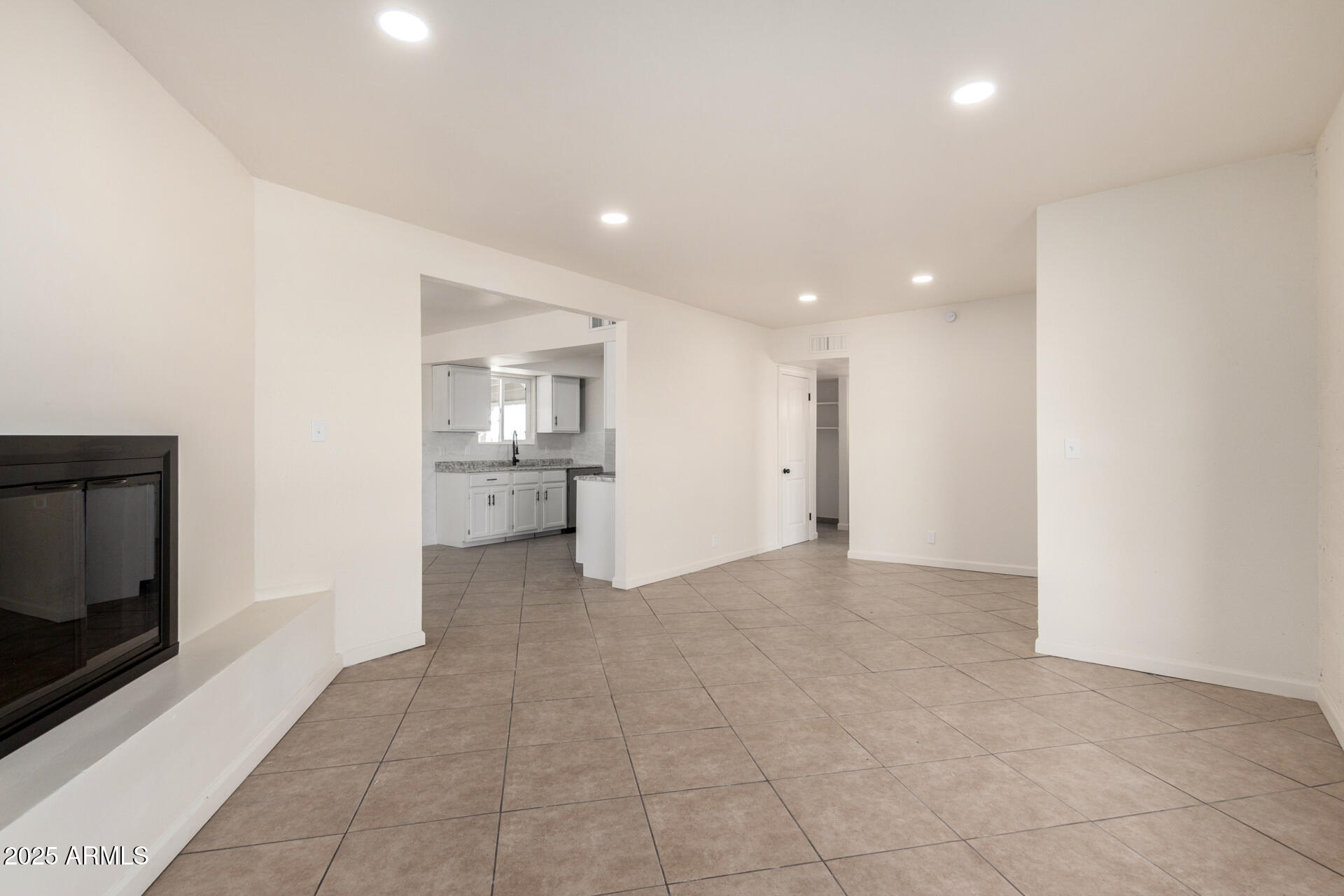 3613 East White Tail Road Pearce, AZ 85625 - Photo 6 of 39 a view of a kitchen with refrigerator and window