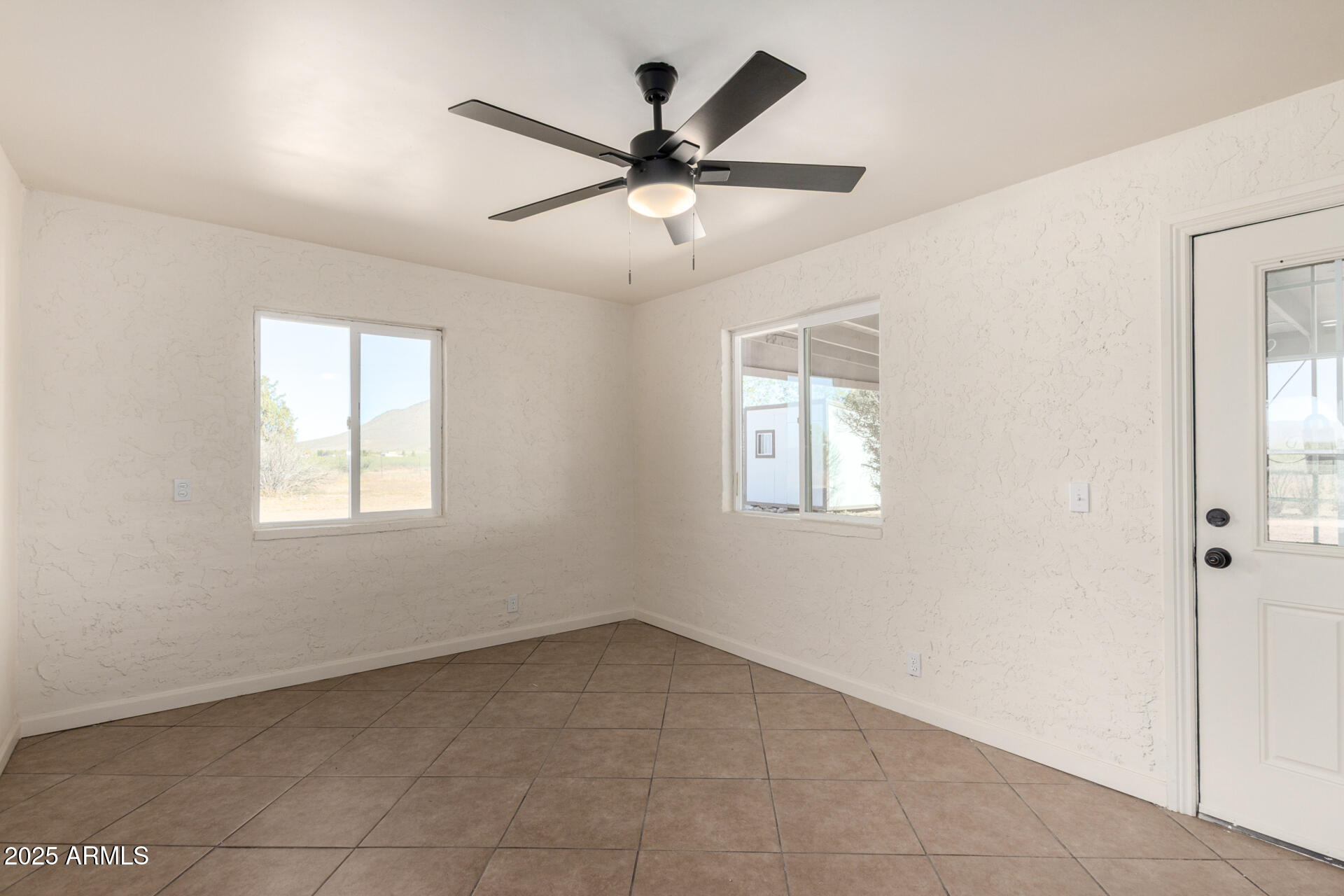 3613 East White Tail Road Pearce, AZ 85625 - Photo 10 of 39 a view of an empty room with a window