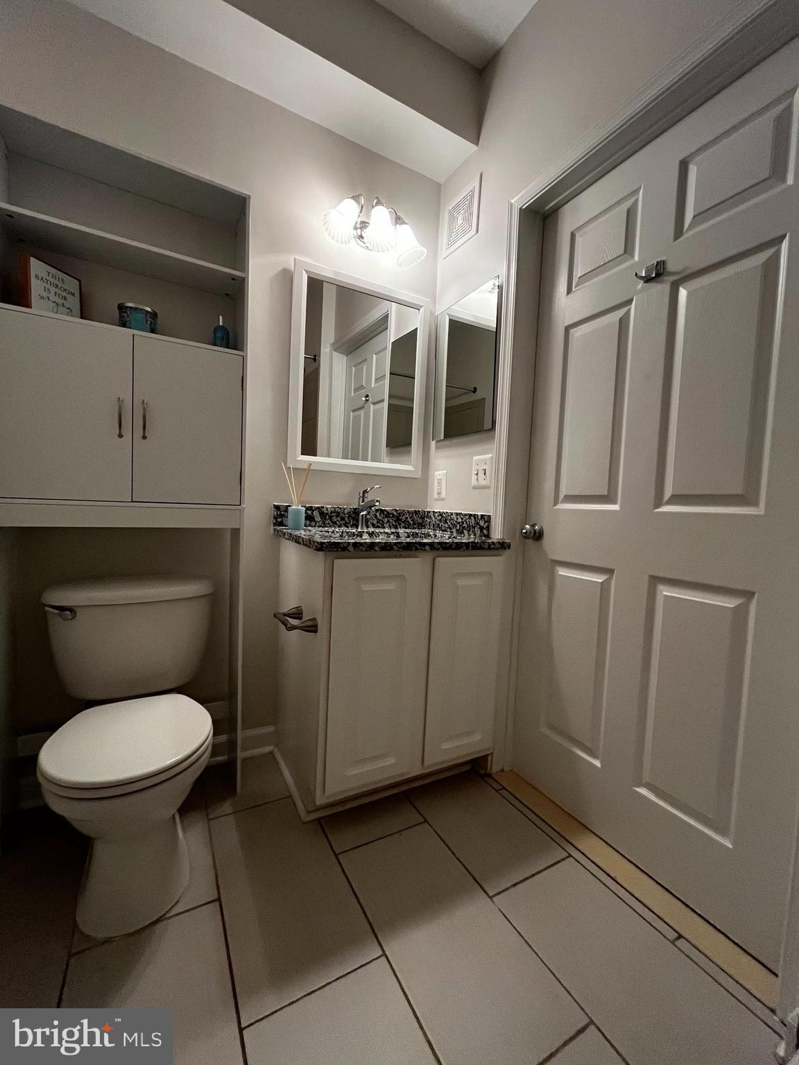 42429 Rockrose Square Brambleton, VA 20148 - Photo 7 of 13 a bathroom with a toilet a sink and mirror