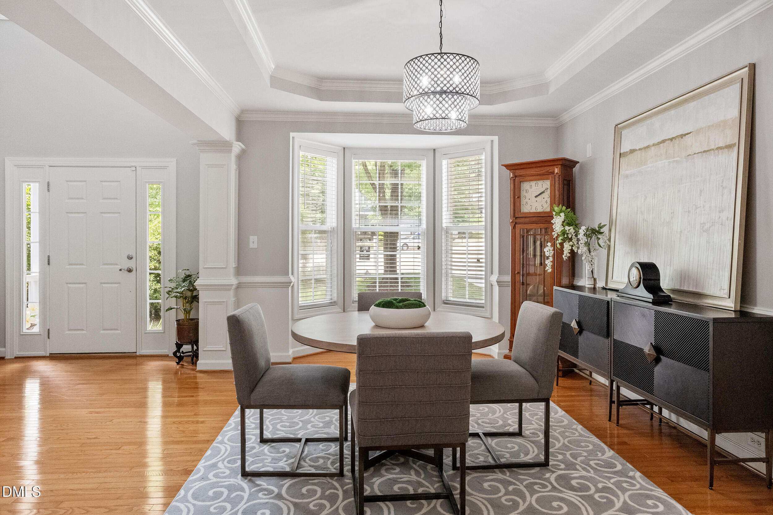 1019 Bianco Drive Raleigh, NC 27607 - Photo 7 of 29 a view of a dining room with furniture window and wooden floor