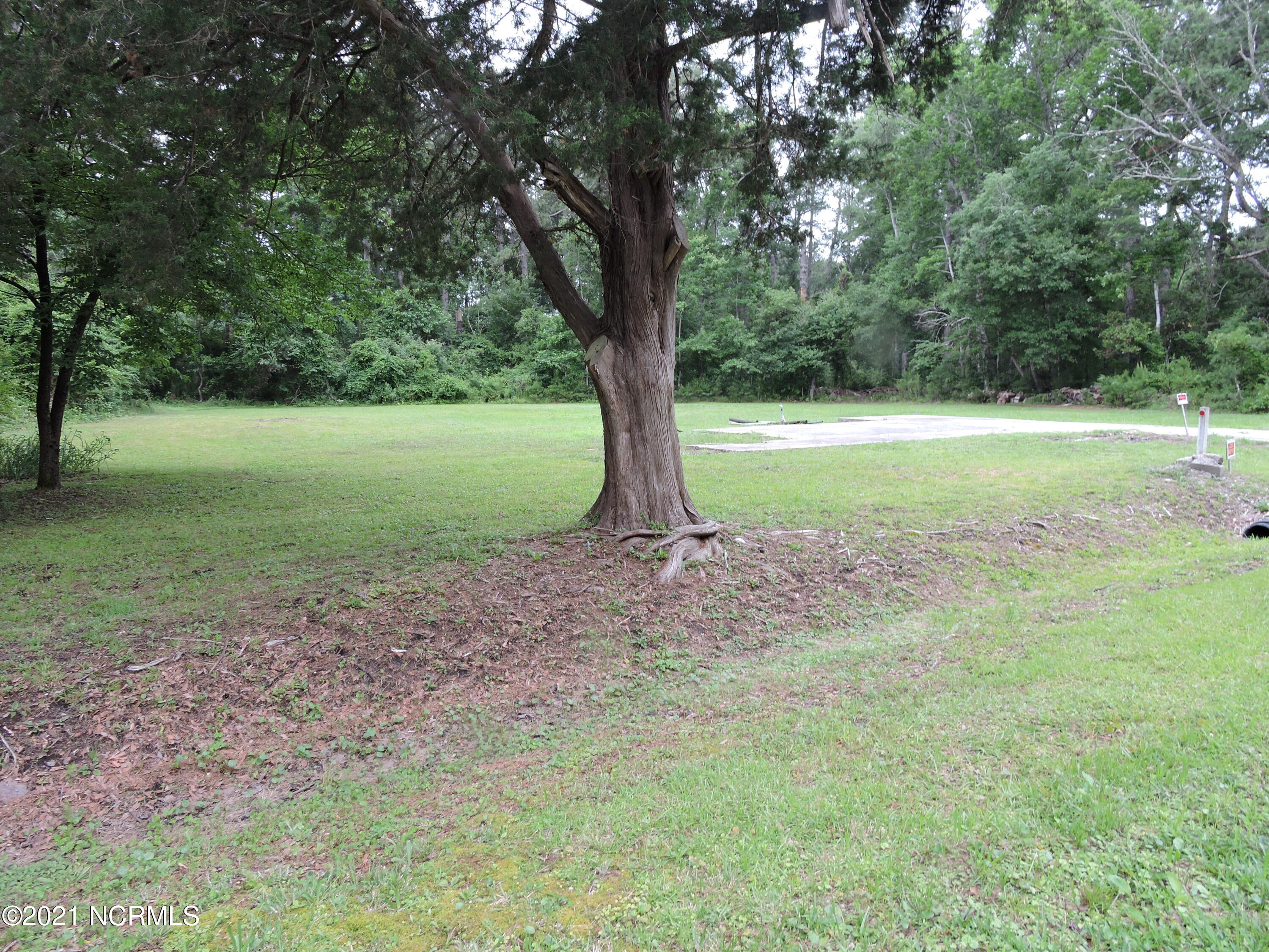 Facing lot from road-left side