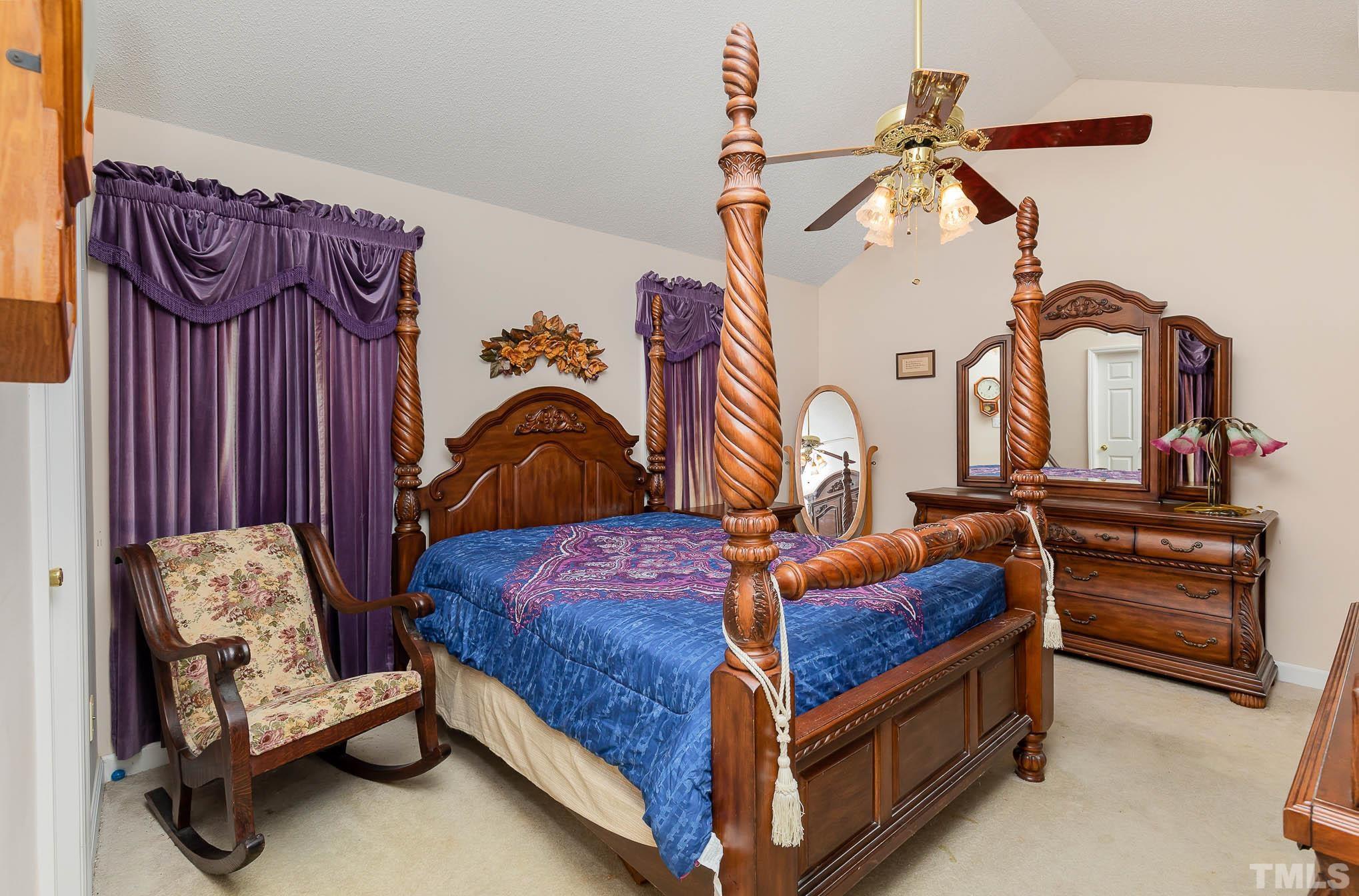 2809 Hayfield Road Wade, NC 28395 - Photo 10 of 22 a bedroom with bed and a mirror