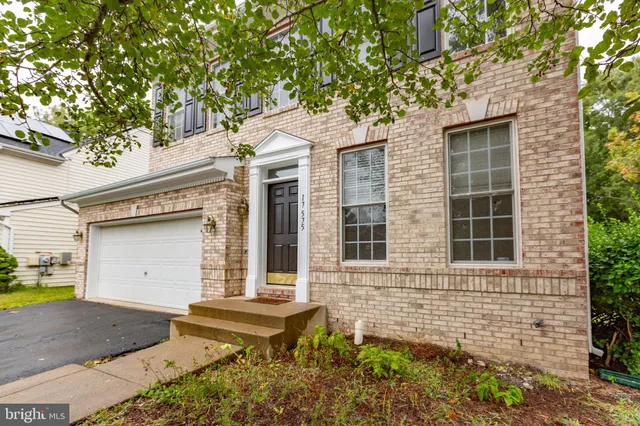 a front view of a house with a garage