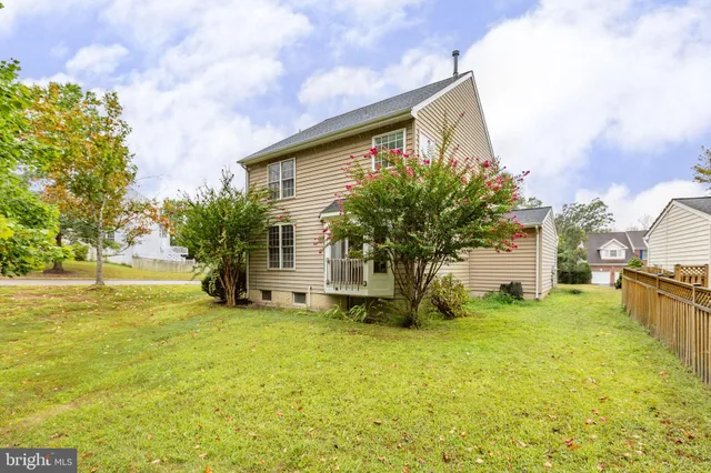 a house view with swimming pool and yard