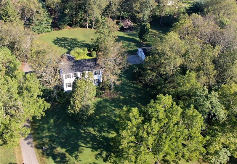 Over two acres of beautiful mature foliage and 2 detached garages on site of this land ready for your need.  