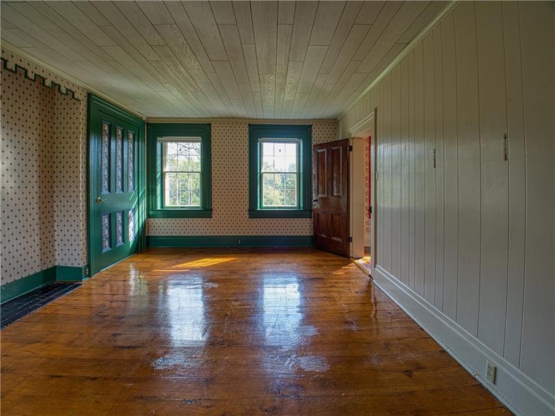 461 Lindsay Road Zelienople, PA 16063 - Photo 19 of 25 A guest bedroom with original wide plank flooring, solid wood doors and two huge closets.