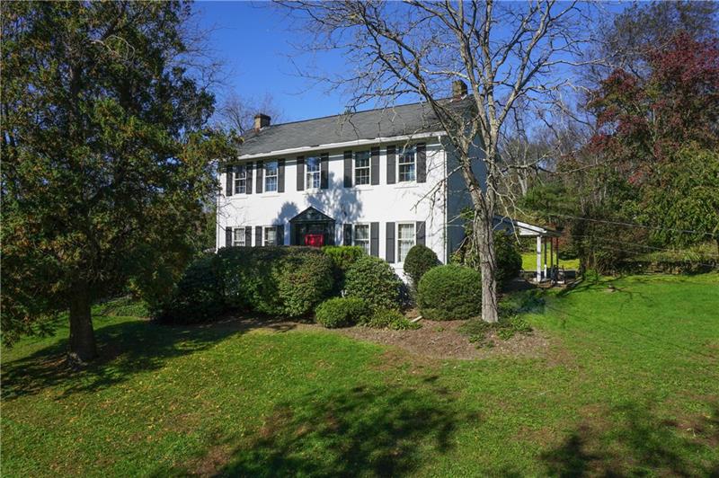 Perched on 2+ acres sits this charming historic home.