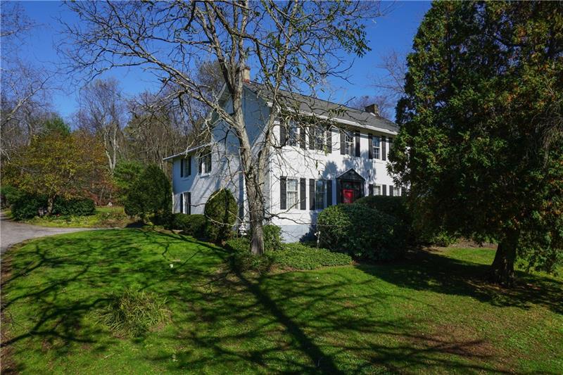 The brick exterior of this historic farmhouse is eye catching and well maintained.