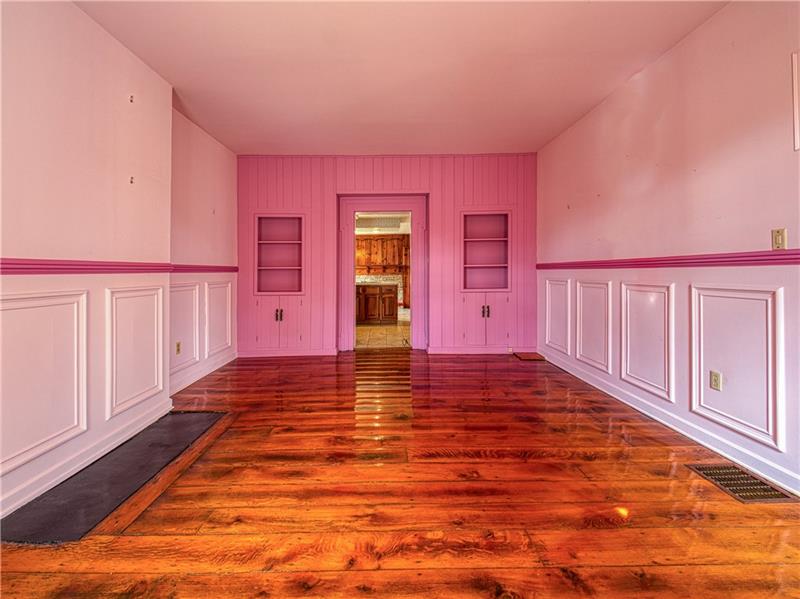 461 Lindsay Road Zelienople, PA 16063 - Photo 8 of 25 The elegant dining room has custom wainscoting, original hardwood floors and built in cabinets and shelving.
