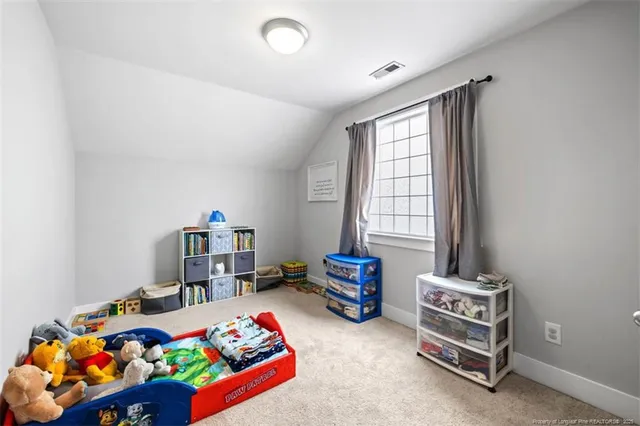 a bedroom with bed and a window