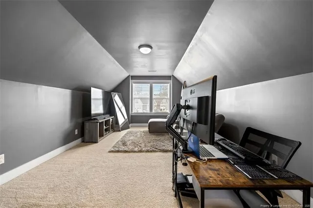 a bedroom with furniture or bed and a flat screen tv