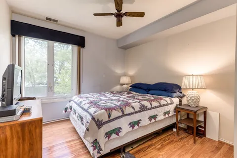 a bed room with a bed and a window