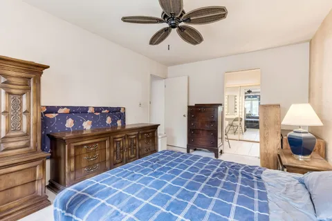 a bed room with a bed and a television