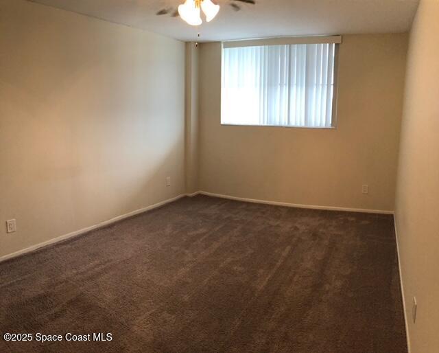 3190 North Atlantic Avenue, Unit 206 Cocoa Beach, FL 32931 - Photo 5 of 14 an empty room with a window