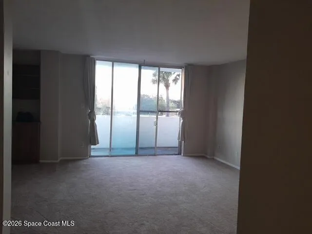 a view of a table and chairs in a patio