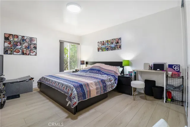 a bedroom with a bed and a couch