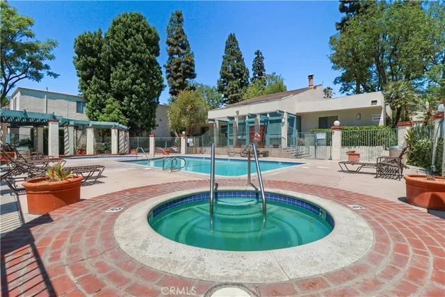 a swimming pool with outdoor seating yard and outdoor seating