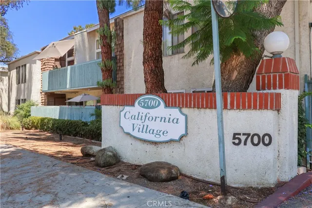 a sign that is on a brick wall