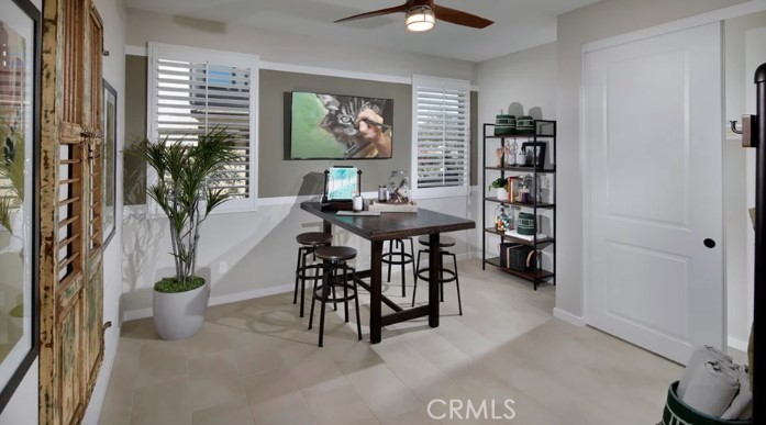 39598 Verbena Way Temecula, CA 92591 - Photo 7 of 19 a view of a dining room with furniture and a potted plant