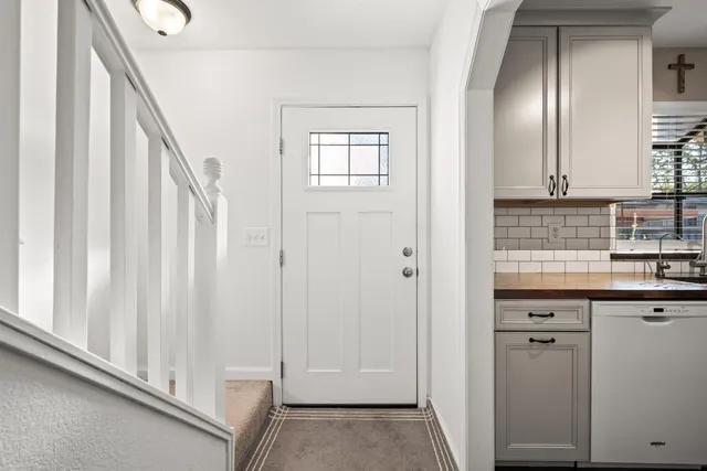 a view of a kitchen from the hallway