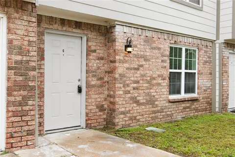 a view of front door of house with yard
