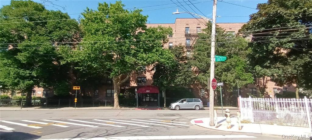 131-11 Kew Gardens Road, Unit 6N Queens, NY 11418 - Photo 1 of 14 a outdoor view of a building with street view