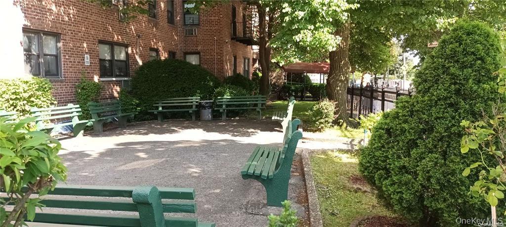 131-11 Kew Gardens Road, Unit 6N Queens, NY 11418 - Photo 11 of 14 a backyard of a house with lots of green space