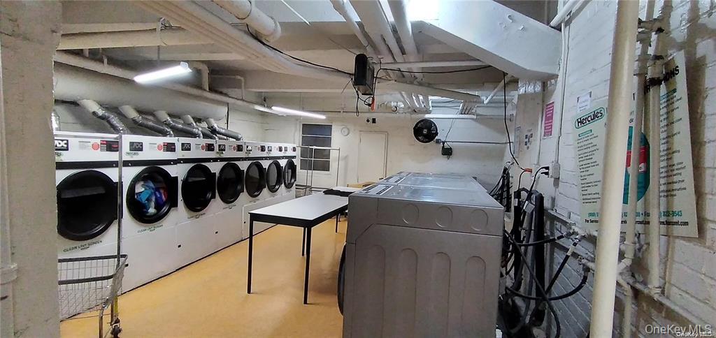 131-11 Kew Gardens Road, Unit 6N Queens, NY 11418 - Photo 14 of 14 a utility room with dryer and washer
