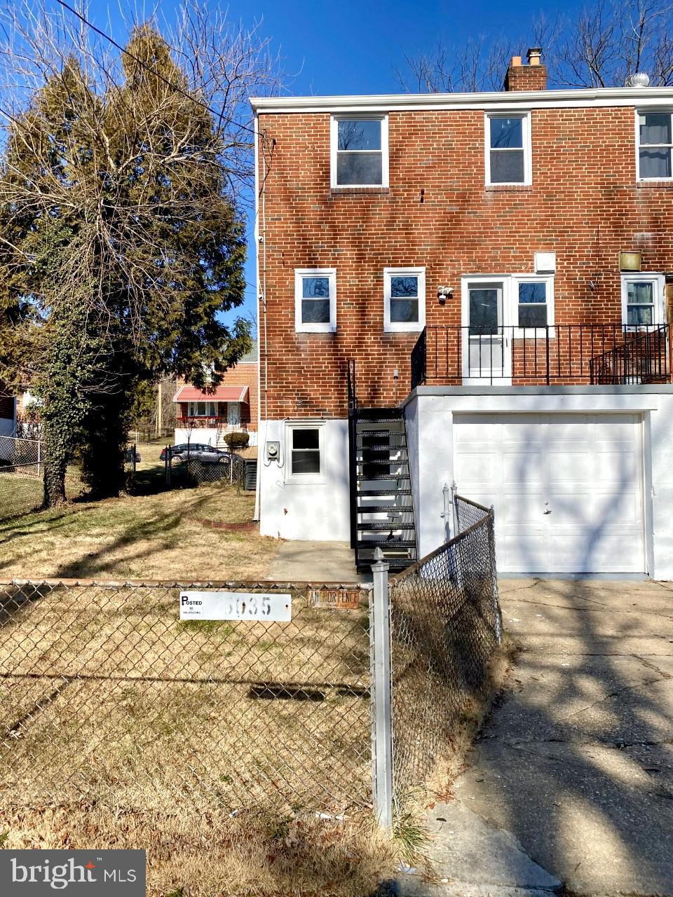 5035 West Hills Road Baltimore, MD 21229 - Photo 20 of 21 a view of a brick house with many windows