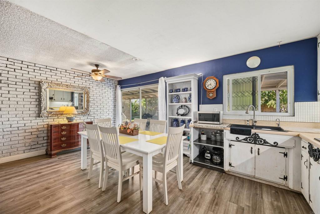 1480 Taylor Avenue Escondido, CA 92027 - Photo 11 of 23 a kitchen with a table chairs stove and cabinets