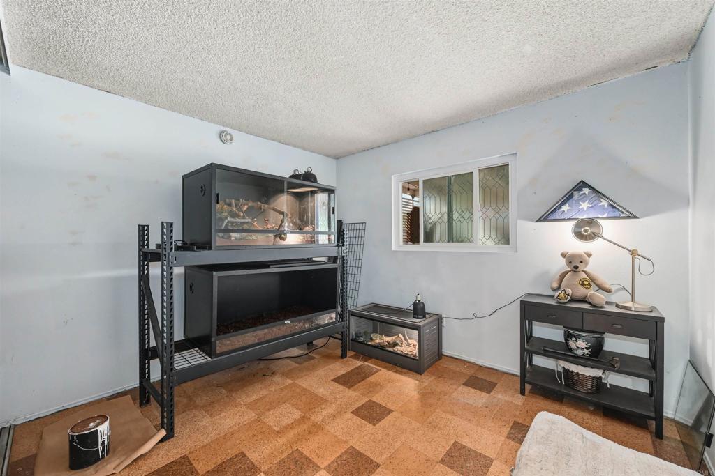 1480 Taylor Avenue Escondido, CA 92027 - Photo 14 of 23 a living room with furniture a piano and a flat screen tv