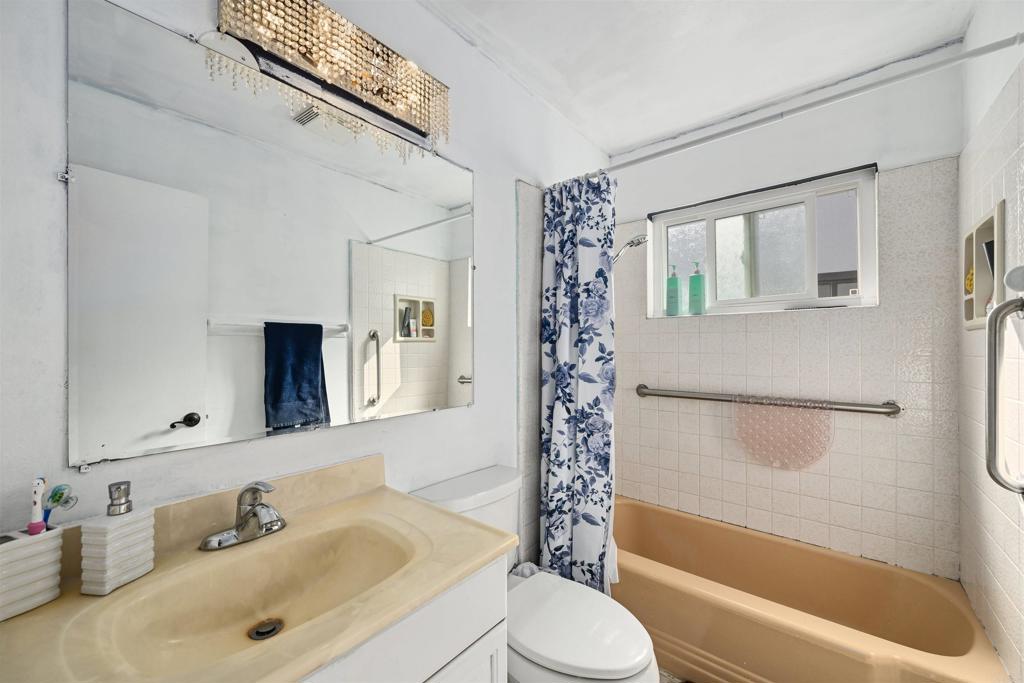 1480 Taylor Avenue Escondido, CA 92027 - Photo 16 of 23 a bathroom with a sink toilet and shower