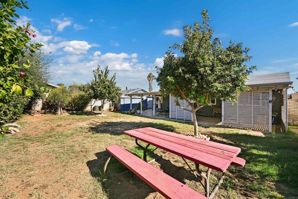 1480 Taylor Avenue Escondido, CA 92027 - Photo 22 of 23 a bench is sitting in the middle of a yard