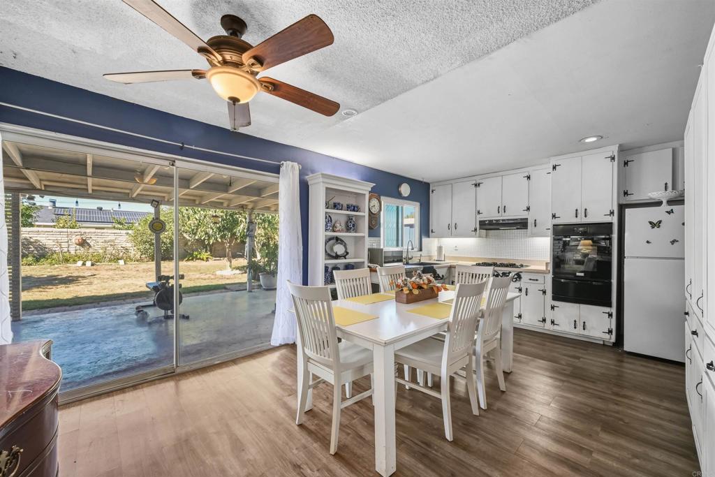 1480 Taylor Avenue Escondido, CA 92027 - Photo 9 of 23 a view of a dining room with furniture window and wooden floor