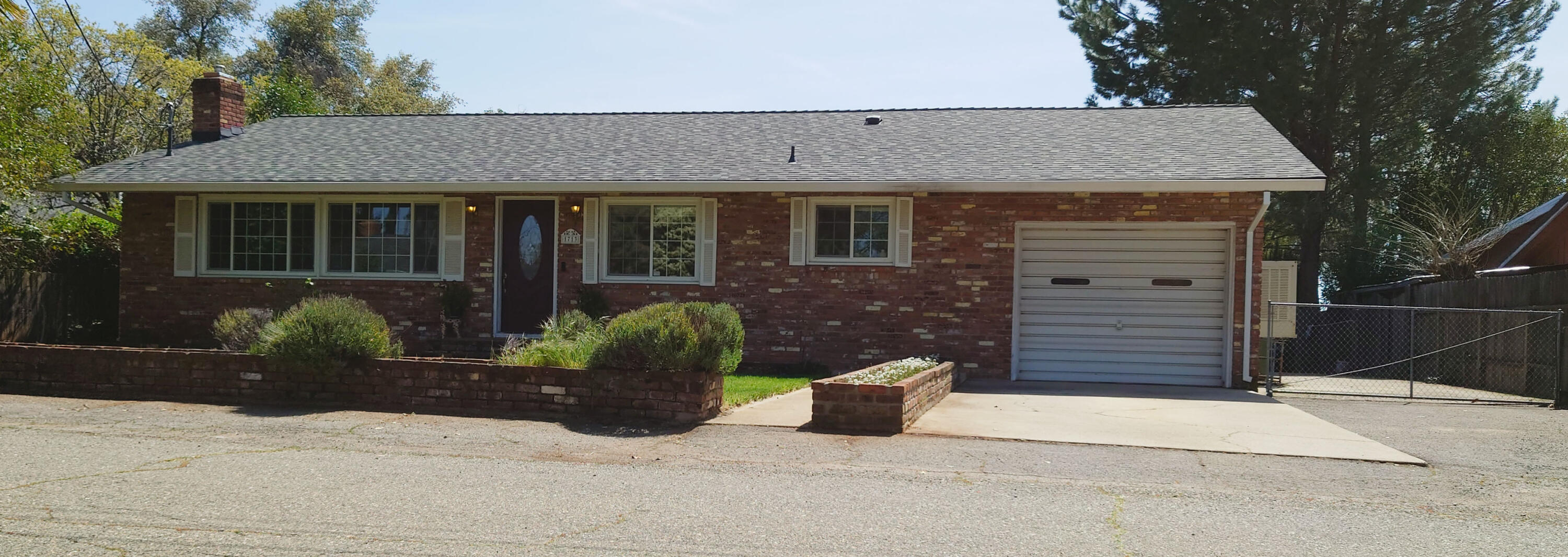 a view of a house with potted plants