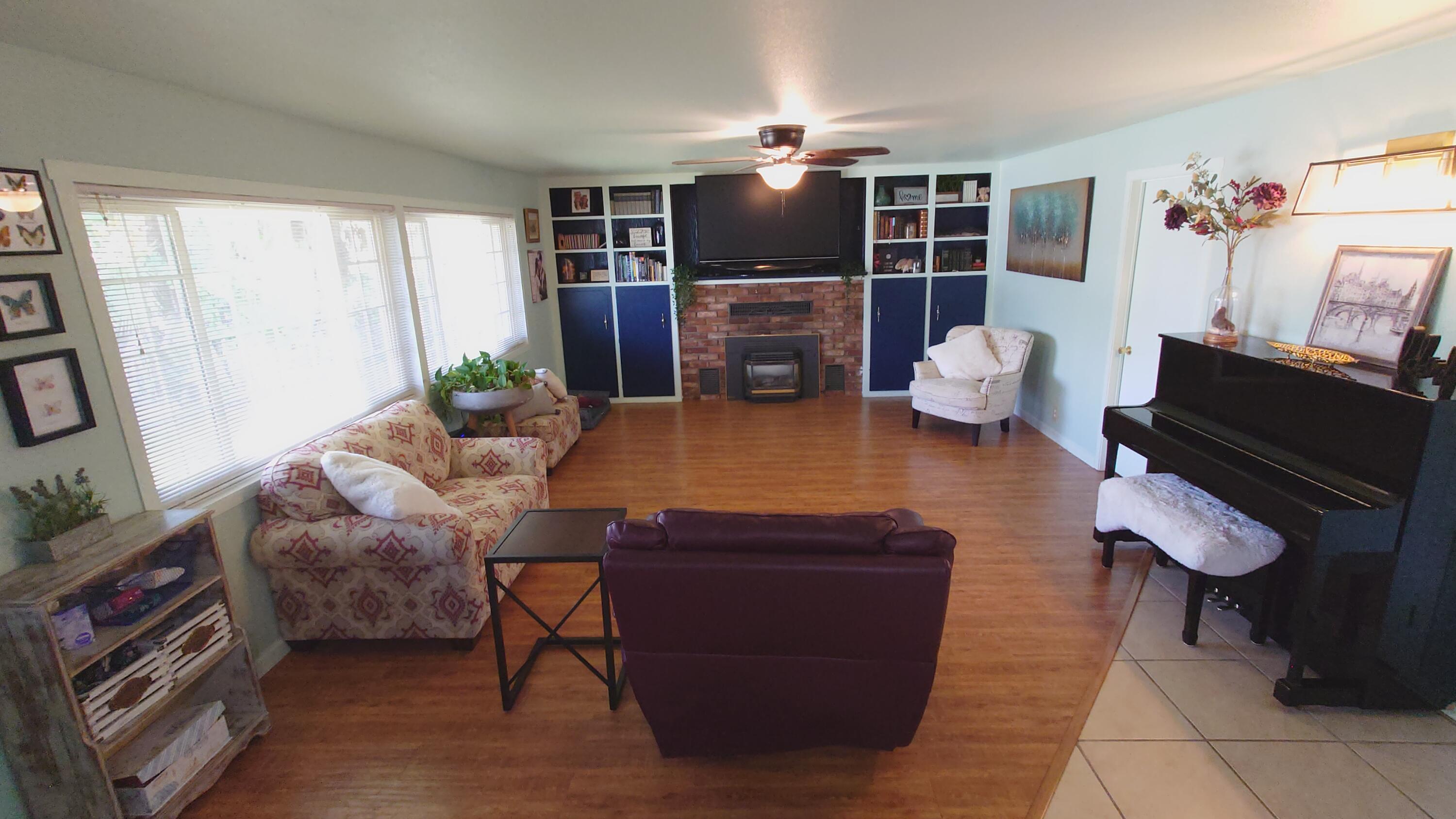 1713 Cascade Lane Redding, CA 96002 - Photo 2 of 12 a living room with furniture and a flat screen tv