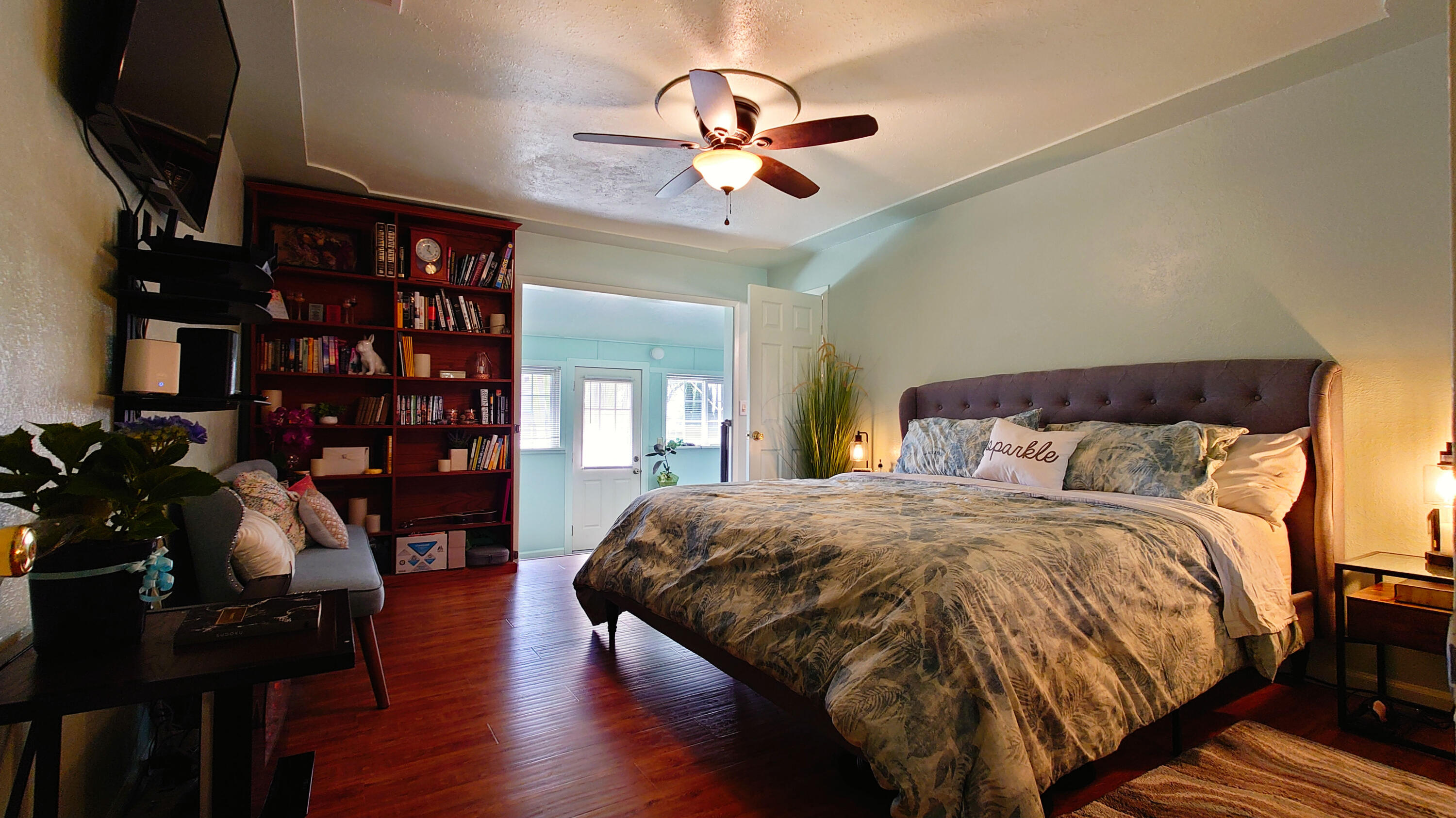 1713 Cascade Lane Redding, CA 96002 - Photo 5 of 12 a spacious bedroom with a bed and wooden floor